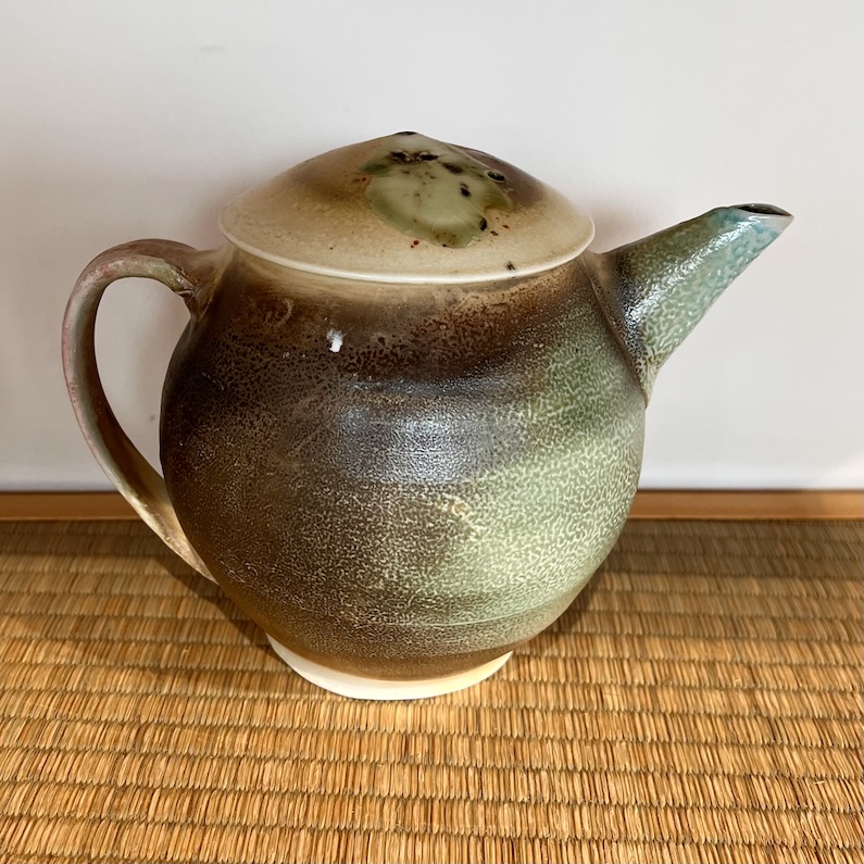 T pot. Sandy soda fired porcelain